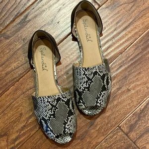 Lovely snakeskin open toe flats.